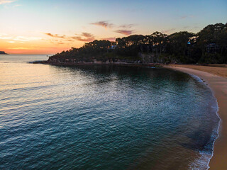 Gentle seas and soft scattered high cloud sunrise seascape