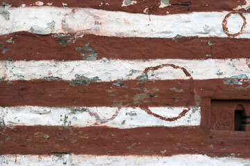 Background texture of painted wood and masonry wall.