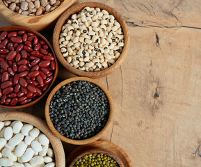 Obraz premium assortment of beans on wooden surface
