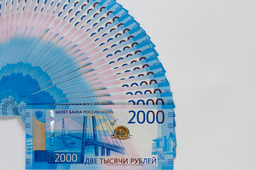 2000 russian rubles bills lies isolated on white background with copy space. Rich life conceptual...