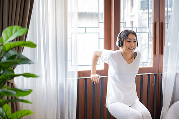 Woman relaxing with yoga at home.