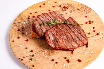 Grilled meat on a bowl with corn