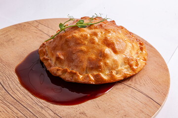 Baked pie with meat and potatoes