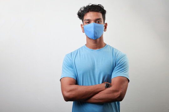 Portrait of a young man of Indian origin wearing face mask