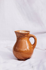 Brown jug on a white background.