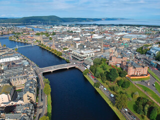 Fototapeta na wymiar Aerial view of Inverness city, showing the beauty of the River Ness with its famous bridges and landmarks the cathedral and castle in the background