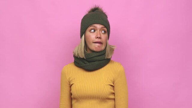 Young cute woman winter clothes confused, feels doubtful and unsure