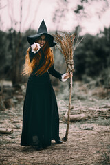 portrait of witch with broomstick