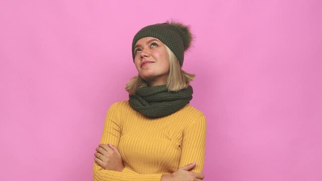 Young cute woman winter clothes dreaming of achieving goals and purposes