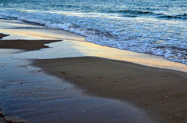 Evening Sea shore. Calm waves by the sea or ocean.