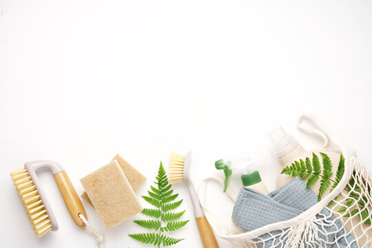 Eco brushes, sponges and rag on white background. Flat lay eco cleaning products. Cleaner concept 