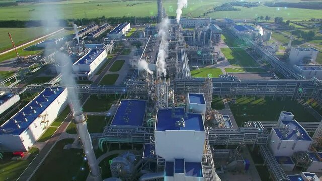 Chemical Plant produces gasoline and mineral fertilisers. Blue lines particles motiongraphics design illustrate energy and working gas oil flows. Aerial flying centrally. Smoke environmental pollution