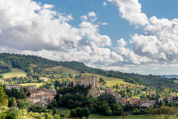 Fototapeta na wymiar Superb panoramic view of the historic center of Sant'Agata Feltria, Emilia Romagna, Italy, against a dramatic sky