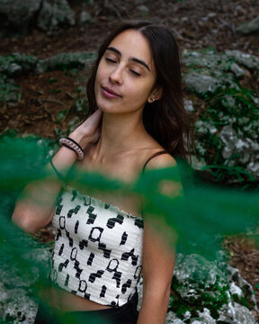 young girl among the branches of a tree