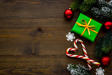 Fototapeta premium Dark Christmas layout with tree branches gifts and decorations