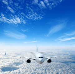 Airplane in the sky. Passenger Airliner in clouds.