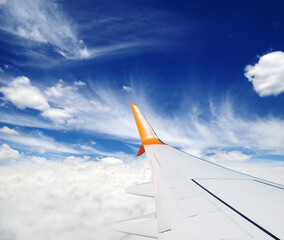 Wing of the plane on sky