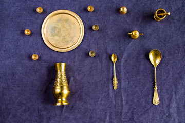 Golden vintage miniature dishware on the table
