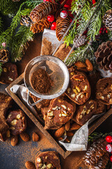 Traditional italian winter and Christmas dessert. Homemade chocolate salami sausage, on festive  background with Christmas decoration