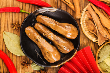 Delicious spiced duck head on a plate