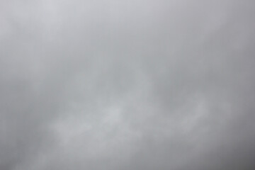 Gray rainy, covered with clouds, sky, cumulus dark clouds in the corner of the frame