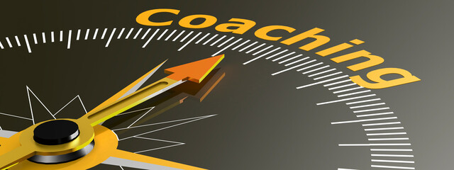 Compass with needle pointing to word coaching