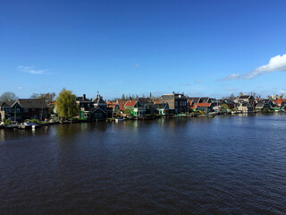 Fototapeta premium landscape of city view near sea coast at blue sky in Zaanse Schans, North Holland, Netherlands