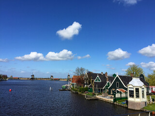 Fototapeta na wymiar landscape of city view near sea coast at blue sky in Zaanse Schans, North Holland, Netherlands