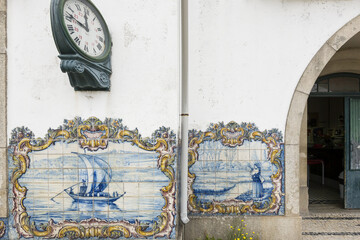 azulejos panels representing  boat on the Douro river on the Sao Mamede de Infesta train station near Porto, Portugal