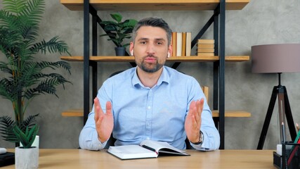 Bearded man remote teacher online tutor in wireless earphones looks camera teaches communicates talk speak students by video call chat conference web cam laptop computer, distance education learning