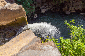 The Saar  mountain river with cold and crystal clear water flows in a crevice in the mountains of...