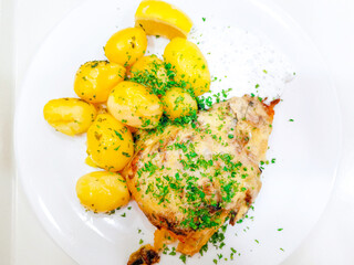 Roasted sleeves chicken with potatoes and barbecue sauce