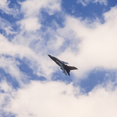 Fototapeta na wymiar Swivel-wing fighter-bomber in rapid overflight