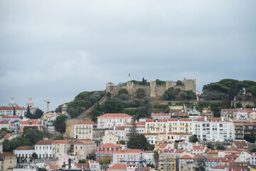 Fototapeta na wymiar Lisbon - Portugal - 2 October 2020 - panorama with Saint Georges castle at the top of the mountain on cloudy sky background