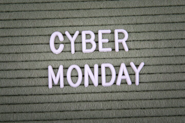 CYBER MONDAY. White letters of the alphabet on a green background.