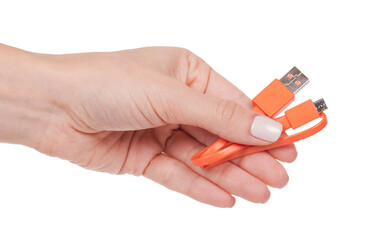 Hand with USB cable, connection wire. Isolated on white background.