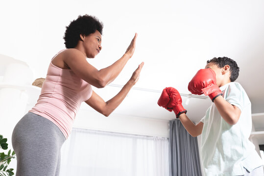 Mother teaching boxing to her son