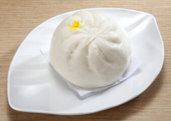 Baozi are a type of steamed, filled bun or bread-like item in various Chinese cuisines, as there is much variation as to the fillings and the preparations. 