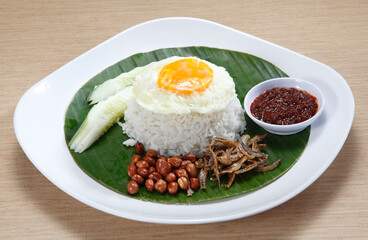 Nasi lemak is a Malay fragrant rice dish cooked in coconut milk and pandan leaf. It is commonly found in Malaysia, where it is considered the national dish.