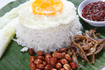 Nasi lemak is a Malay fragrant rice dish cooked in coconut milk and pandan leaf. It is commonly found in Malaysia, where it is considered the national dish.