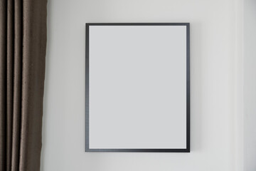 blank frame picture on the wall of interior house with  curtain