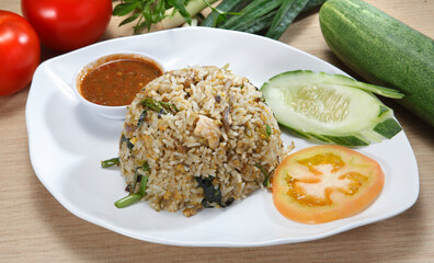 fried rice-Fried rice is a dish of cooked rice that has been stir-fried in a wok or a frying pan and is usually mixed with other ingredients such as eggs, vegetables, seafood, or meat.