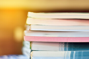 The side corner of the stack of books stacked together