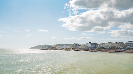 Eastbourne beach and seafront, England. A busy summer seafront at the popular English seaside resort on the Sussex coast.