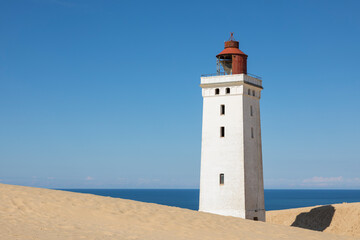Fototapeta na wymiar Rubjerk Knude Fyr, famous lighthouse in the North Sea dunes of Denmark