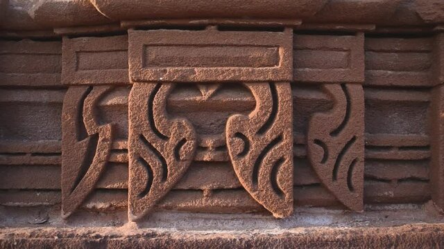 Close up shot of stone carving on ancient Indian temple wall