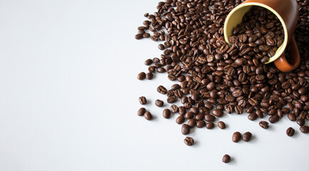 coffee beans in brown glass on white table background. top view. space for text