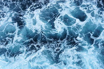 Foam on the surface of the seething sea. Abstraction. Background.