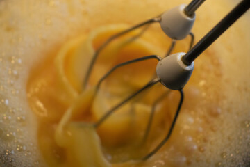 Beating the dough with the whisk of a mixer - cooking at home