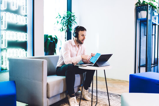 Handsome Male Professional Making Online Web Conference For Communicate With Business Partner And Discuss Crypto Currency Exchange On Stock Site, Caucasian Man In Headphones For Noise Cancellation